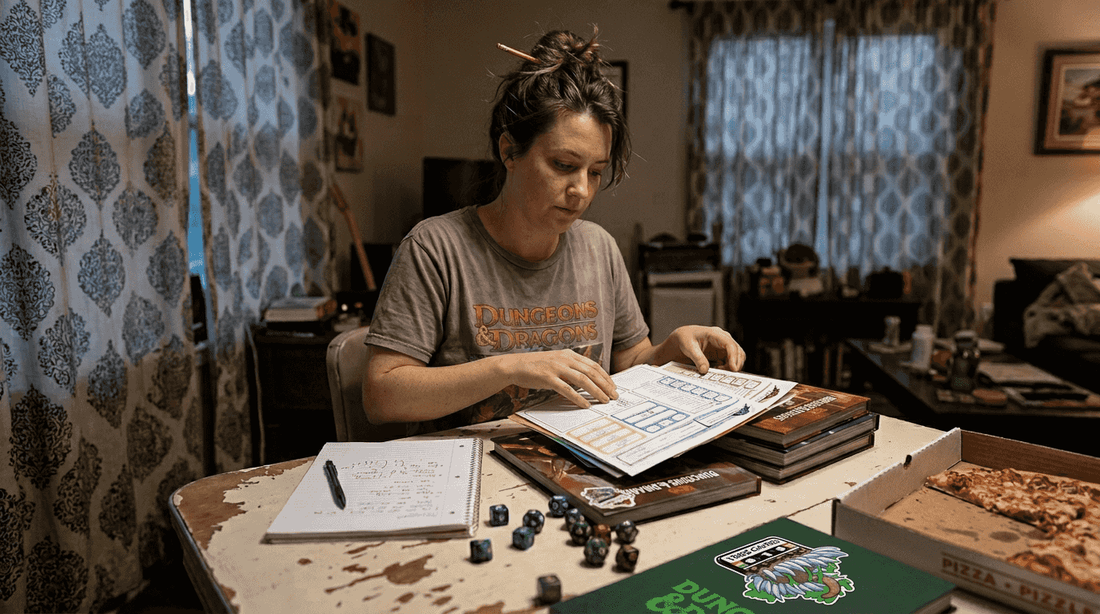 DM preparing D&D materials at home table